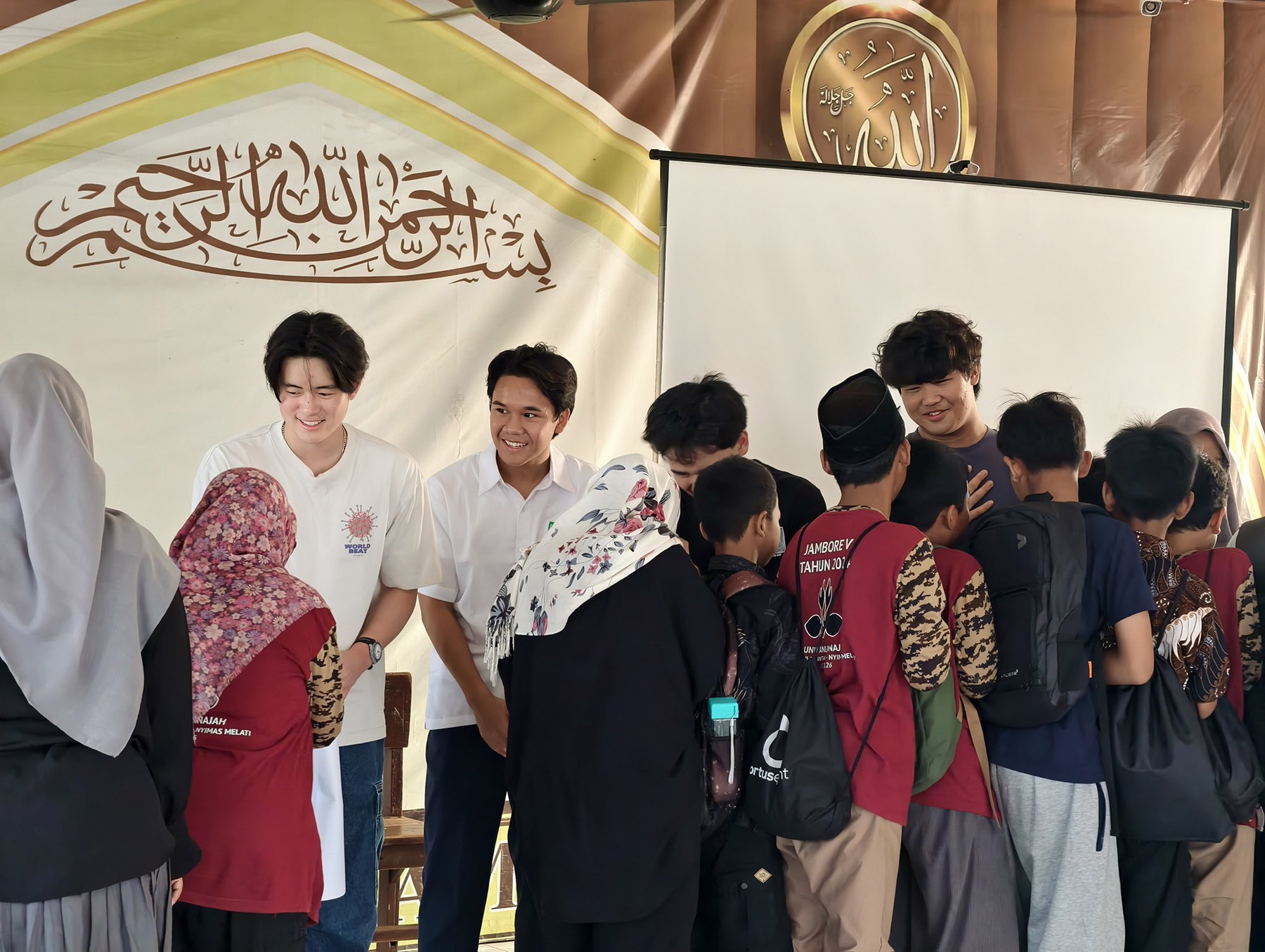 Students and Abhipraya volunteers gathered together at the front of the learning space