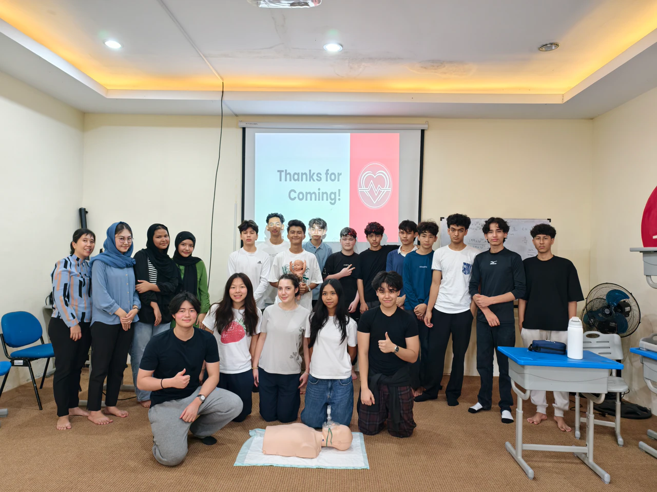 Students and volunteers posing together after a Beatkeepers workshop