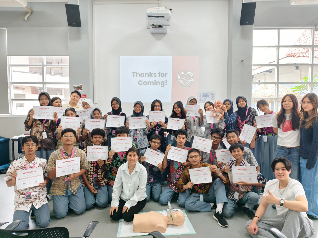 Workshop participants holding their certificates alongside Beatkeepers volunteers